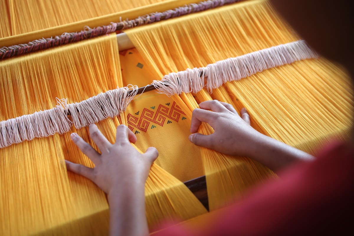 A Colombian artisan working with a local supplier